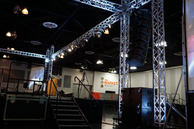 A stage with lights and stairs in the middle of it