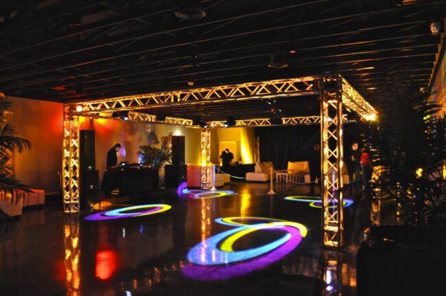 Indoor event space with truss lighting and gobos
