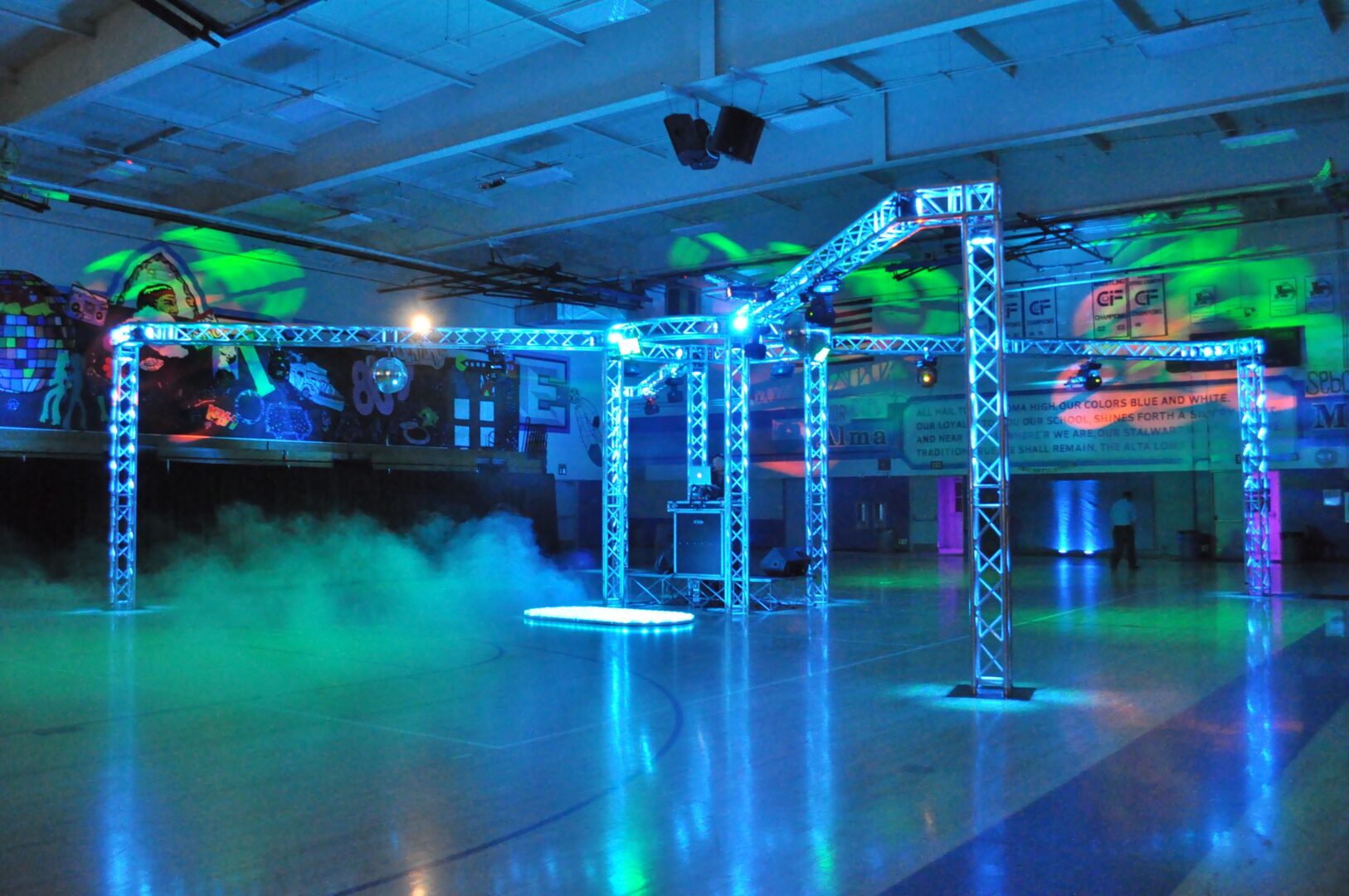 A dance floor with lights and a blue light