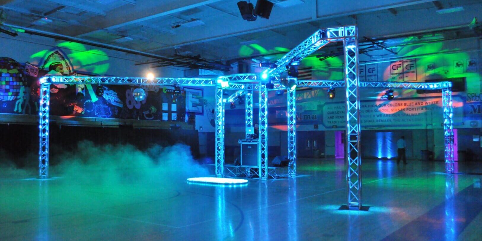 A dance floor with lights and a blue light