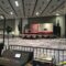 A large room with an american flag on the wall.