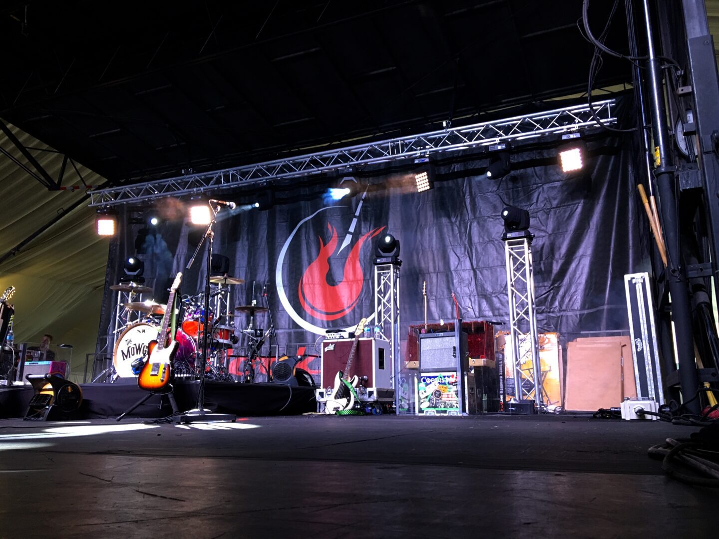 A stage with lights and a guitar player